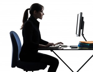 one caucasian business woman computer computing typing in silho